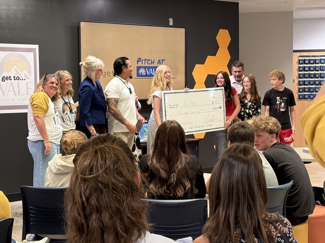 A VALE student finalist receiving $100 seed funding from the Global Doing Good Benjamin Project